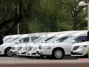Hearses of the family members who were killed in a flash flood are parked outside St. Patrick church, Tuesday, July 25, 2017, in Scottsdale, Ariz. Ten members of an extended Arizona family were killed earlier this month in flash flood while they celebrated a birthday are being remembered as hard-working immigrants from Mexico trying to provide a better life for their children. (AP Photo/Matt York)