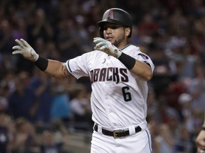 Arizona Diamondbacks' David Peralta celebrates after hitting a solo home run against the Washington Nationals during the first inning of a baseball game, Friday, July 21, 2017, in Phoenix. (AP Photo/Matt York)