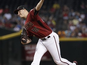 Arizona Diamondbacks starting pitcher Patrick Corbin throws against the Cincinnati Reds during the third inning of a baseball game, Sunday, July 9, 2017, in Phoenix. (AP Photo/Matt York)