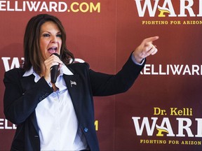 FILE - In this July 14, 2015, file photo, Arizona State Sen. Kelli Ward officially announces that she is running against Sen. John McCain for the U.S. Senate in Lake Havasu City, Ariz. Ward, who tried to oust McCain last year is suggesting that he resign because he's been diagnosed with an aggressive form of brain cancer, Friday, July 21, 2017. (Tom Tingle/The Arizona Republic via AP, File)