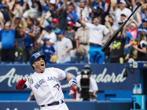 Toronto Blue Jays left fielder Steve Pearce throws his bat in celebration after hitting a walk-off grand slam on July 27, 2017.