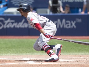 Boston Red Sox right fielder Mookie Betts hits an RBI single off Toronto Blue Jays starting pitcher Joe Biagini during second inning Major League baseball action in Toronto on Sunday July 2, 2017. THE CANADIAN PRESS/Chris Young