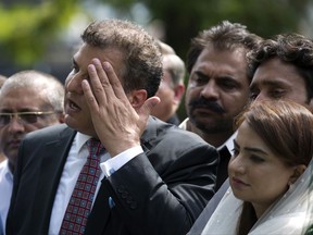 Daniyal Aziz, a senior leader from the ruling party, gives a news conference outside the Supreme Court in Islamabad, Pakistan, Monday, July 10, 2017. Pakistani officials said Monday an anti-graft probe into corruption allegations against Prime Minister Nawaz Sharif's family is over and that the investigators have handed over their report to the Supreme Court. Aziz said they will issue a comprehensive response after examining the report. (AP Photo/B.K. Bangash)