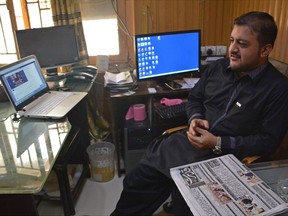 In this Saturday, July 9, 2017 photo, journalist Zafar Achakzai, who was held for sharing content criticizing security forces on social media, sits in his office after being released from jail, in Quetta, Pakistan. A senior Pakistani government official says more than 40 of 65 organizations banned in Pakistan are operating flourishing social media sites. Meanwhile, Pakistan is waging a cyber crackdown on activists and journalists who use social media to criticize the government, the military or the intelligence agencies. (AP Photo/Arshad Butt)