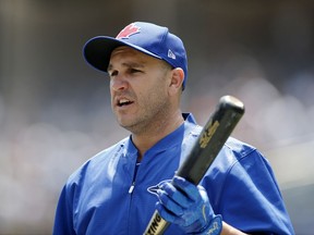 Toronto Blue Jays' Miguel Montero holds a bat between turns in the batting cage before a baseball game against the New York Yankees at Yankee Stadium in New York, Tuesday, July 4, 2017. The Blue Jays acquired Montero from the Chicago Cubs for a player to be named later or cash considerations after designating him for assignment less than 24 hours after he blamed pitcher Jake Arrieta for the seven stolen bases Chicago allowed against the Washington Nationals. (AP Photo/Kathy Willens)