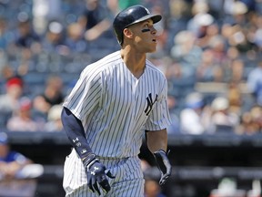 New York Yankees' Aaron Judge watches his two-run home run in the fourth inning of a baseball game against the Toronto Blue Jays in New York, Wednesday, July 5, 2017. (AP Photo/Kathy Willens)