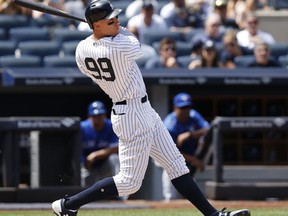 New York Yankees right fielder Aaron Judge (99) hits a fifth-inning single with two runners on base in a baseball game against the Toronto Blue Jays in New York, Wednesday, July 5, 2017. (AP Photo/Kathy Willens)
