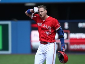 Toronto Blue Jays 3B Josh Donaldson mops his brow after grounding out against the Boston Red Sox on July 2.