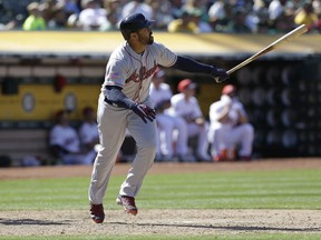 Atlanta Braves' Matt Kemp watches his RBI double hit off Oakland Athletics' Daniel Coulombe in the eleventh inning of a baseball game, Sunday, July 2, 2017, in Oakland, Calif. (AP Photo/Ben Margot)