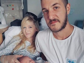 This is an undated hand out photo of Chris Gard and Connie Yates with their son Charlie Gard provided by the family, at Great Ormond Street Hospital, in London.