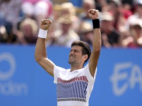 Serbia's Novak Djokovic celebrates winning the match against France's Gael Monfils in the Men's Singles Final, of the AEGON International tennis tournament at Devonshire Park, Eastbourne, England, Saturday, July 1, 2017. (Steven Paston/PA via AP)