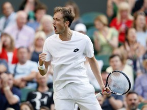 Russia's Daniil Medvedev celebrates after winning the third set of his Men's Singles Match against Switzerland's Stan Wawrinka, on the opening day at the Wimbledon Tennis Championships in London Monday, July 3, 2017. (AP Photo/Kirsty Wigglesworth)