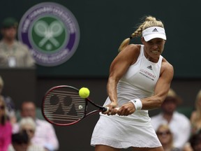 Germany's Angelique Kerber returns to Irina Falconi of the United States during their Women's Singles Match on day two at the Wimbledon Tennis Championships in London Tuesday, July 4, 2017. (AP Photo/Alastair Grant)