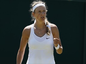Victoria Azarenka of Belarus celebrates a point against Russia's Elena Vesnina during their Women's Singles Match on day three at the Wimbledon Tennis Championships in London Wednesday, July 5, 2017. (AP Photo/Kirsty Wigglesworth)