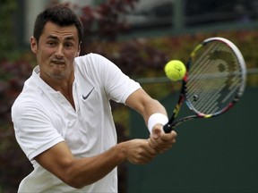 Australia's Bernard Tomic returns to Germany's Mischa Zverev during their Men's Singles Match on day two at the Wimbledon Tennis Championships in London Tuesday, July 4, 2017. (AP Photo/Alastair Grant)