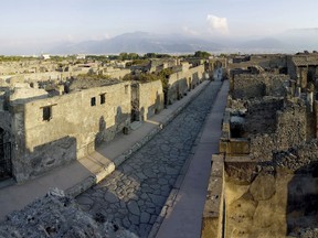 Undated handout photo issued by the British Musuem Thursday Sept. 20, 2012 of Pompeii, Bay of Naples, Italy. New science suggests ancient cities sea walls withstood the test of time because their chemical makeup continued to react with salt in the water and air.