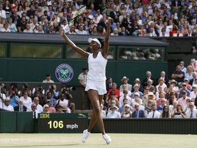 Venus Williams of the United States celebrates after beating Britain's Johanna Konta in the Women's Singles semifinal match on day nine at the Wimbledon Tennis Championships in London Thursday, July 13, 2017.