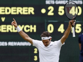 Switzerland's Roger Federer celebrates after beating Czech Republic's Tomas Berdych at the end of their Men's Singles semifinal match on day eleven at the Wimbledon Tennis Championships in London, Friday, July 14, 2017.