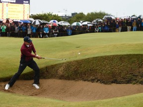 American Jordan Spieth hits a bunker shot during second-round action at the British Open ongoing at the Royal Birkdale Golf Club in Southport, England. Spieth had a 1-under 69 in nasty conditions and has a two-stroke lead at the midway point of the tournament.