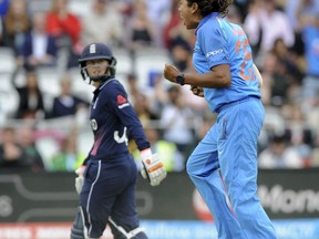 India's Jhulan Goswami, right, celebrates after dismissing England's Fran Wilson, left, for no score during the ICC Women's World Cup 2017 final match between England and India at Lord's in London, England, Sunday, July 23, 2017. (AP Photo/Rui Vieira)