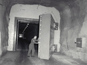 In this undated photo, a member of the Canadian Forces opens with ease one of the three perfectly balanced 17.25-tonne blast doors protecting the now-unused underground complex that housed NORAD headquarters in North Bay, Ont.