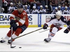 FILE - In this Jan. 14, 2017, file photo, Florida Panthers left wing Jussi Jokinen (36) skates with the puck as Columbus Blue Jackets left wing Matt Calvert (11) defends during the second period of an NHL hockey game in Sunrise, Fla. NHL teams are taking advantage of their final chance to buy out players this offseason. Among the players placed on unconditional waivers for buyout purposes was Jokinen. (AP Photo/Lynne Sladky, File)