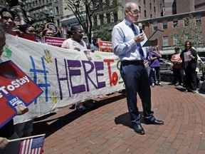 In this Thursday, July 6, 2017 file photo, Ronnie Millar, of the Boston-based Irish International Immigrant Center, addresses a "Here to Stay" rally at the Irish Famine Memorial in Boston, where immigration activists and labor groups gathered to oppose the president's crackdown on illegal immigration. Immigration and Customs Enforcement data provided to The Associated Press show that more than 1,300 Europeans were deported through June 24. About 1,450 Europeans were deported in 2016. (AP Photo/Charles Krupa)