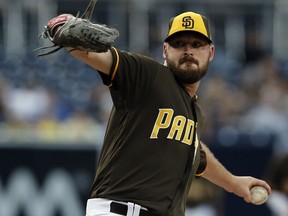 San Diego Padres pitcher Travis Wood throws during the first inning of the team's baseball game against the Pittsburgh Pirates in San Diego, Friday, July 28, 2017. (AP Photo/Alex Gallardo)
