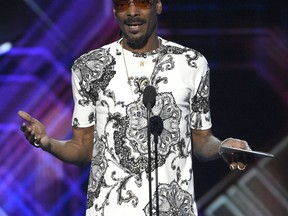 Snoop Dogg presents the award for best game at the ESPYS at the Microsoft Theater on Wednesday, July 12, 2017, in Los Angeles. (Photo by Chris Pizzello/Invision/AP)