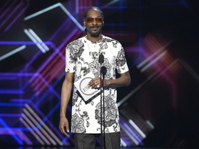 Snoop Dogg presents the award for best game at the ESPYS at the Microsoft Theater on Wednesday, July 12, 2017, in Los Angeles. (Photo by Chris Pizzello/Invision/AP)