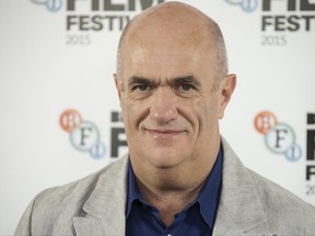 FILE - In this Oct. 12, 2015 file photo, author Colm Toibin poses for photographers during the photo call for Brooklyn, as part of the London Film Festival, at a central London hotel. Irish novelist, journalist and essayist Toibin is this year's winner of a lifetime achievement award that celebrates the power of literature to foster peace, social justice and global understanding, organizers announced Thursday, July 13, 2017. Toibin will receive this year's Richard C. Holbrooke Distinguished Achievement Award. (Photo by Joel Ryan/Invision/AP, File)