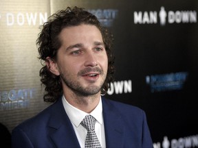 FILE - In this Nov. 30, 2016 file photo, Shia LaBeouf arrives at the Los Angeles premiere of "Man Down" at ArcLight Cinemas Hollywood. LaBeouf has apologized for a racist tirade against officers who arrested him for public drunkenness over the weekend in Savannah, Ga. The actor wrote in a statement posted on Twitter Wednesday, July 12, 2017, that he has been publicly struggling with addiction for what he was said was "far too long." (Photo by Chris Pizzello/Invision/AP, File)