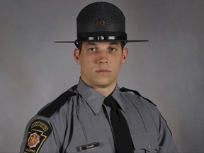 FILE - This undated file photo provided by Pennsylvania State Police shows Trooper Michael P. Stewart. Stewart, 26, was killed when his marked cruiser collided with a garbage truck last week. His funeral service is scheduled to begin at 10 a.m. Tuesday, July 18, 2017, at Holy Family Church in Latrobe. (David J. Watson/Pennsylvania State Police via AP, File)
