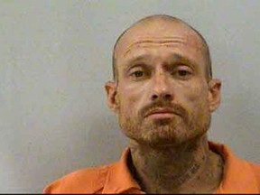 This booking photo provided by McDowell County Sheriffs Office shows Phillip Michael Stroupe II, Thursday, July 27, 2017. Having brought a rugged, six-day North Carolina manhunt to an end, authorities are now desperately searching for the missing owner of the stolen truck the captured fugitive, Stroupe, was driving. Stroupe was arrested after a two-county chase at 1:30 a.m. Thursday, on U.S. Highway 70, west of Marion, about 50 miles away. (McDowell County Sheriffs Office via AP)