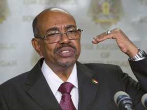 FILE - In this Monday, Jan. 6, 2014 file photo, Sudanese President Omar al-Bashir speaks after meeting with South Sudan's President Salva Kiir, in the capital Juba, South Sudan. The United States is facing calls to maintain pressure on Sudan's government, on Tuesday, July 11, 2017 the day before Washington is expected to announce the permanent lifting of sanctions dating back to the 1990s. (AP Photo/Ali Ngethi, File)