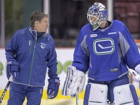 VANCOUVER, B.C. : JANUARY 15, 2013 -- Vancouver Canuck goaltending coach Roland Melanson talks with Cory Schneider, January 15th, at Vancouver's Rogers arena during the morning session of training camp.     (Ward Perrin/PNG) (For story by SPORTS/The Province  SPORTS/Vancouver Sun)          00017663A   00017655A [PNG Merlin Archive]