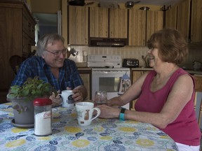 Bonnie and Doug Main talk as they sit at their kitchen table at their home Wednesday July 5, 2017 in Orleans, Ont. After decades of heart problems, Bonnie's heart grew so weak that doctors said it was time to consider a heart transplant. Last year, the 67-year-old was put on a years-long waiting list and told to stay within three hours of the heart institute. THE CANADIAN PRESS/Adrian Wyld