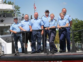 cdn-coastMembers of Amherstburg's Canadian Coast Guard and Auxiliary stand aboard the Colchester Guardian on July 18, 2017. From left: Herb Ruthven, Mike Drexler, and Jim Oakley of the Colchester Guardian; Greg Colbeck, Sondi Ryersee, Jana Lorbetski, and Jeff Faucher of the Thunder Cape.-guard-01