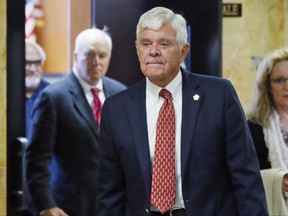 FILE - In this July 15, 2016, file photo, former Tulsa County Sheriff Stanley Glanz leaves a Tulsa County courtroom in Tulsa, Okla. According to a federal lawsuit filed Thursday, July 20, 2017, Glanz forced Tulsa County Sheriff's Maj. Tom Huckeby, a former high-ranking sheriff's official, to "take the hit" and resign following the shooting of an unarmed black man by a white reserve deputy whose qualifications subsequently came under heavy scrutiny. (AP Photo/Sue Ogrocki, File)