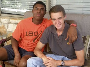 In this 2016 photo provided by John Gramlich shows, Bakari Henderson, left, with friend Travis Jenkins, in Austin, Texas. Henderson, of Austin and recent graduate from the University of Arizona, was beaten to death early Friday, July 7, 2017, at a bar in Lagana on the Greek island of Zakynthos.