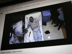 In this Thursday, June 29, 2017, photo, an online video clip shows China's jailed Nobel Peace laureate Liu Xiaobo lying on a bed receiving medical treatment at a hospital in Beijing.