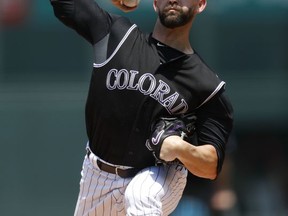 Colorado Rockies starting pitcher Tyler Chatwood delivers a pitch to Cincinnati Reds Billy Hamilton in the first inning of a baseball game Thursday, July 6, 2017, in Denver. (AP Photo/David Zalubowski)