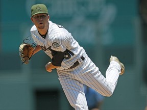 Colorado Rockies starting pitcher Kyle Freeland delivers to Chicago White Sox's Adam Engel in the first inning of a baseball game Sunday, July 9, 2017, in Denver. (AP Photo/David Zalubowski)