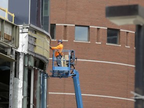In this Thursday, May 19, 2016, photo a worker works on a high-rise building in Boston. On Monday, July 3, 2017, the Commerce Department reports on U.S. construction spending in May. (AP Photo/Steven Senne)