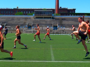 Wolfpack rugby players warm up before practice in Toronto on Wednesday July 5, 2017. THE CANADIAN PRESS/Neil Davidson