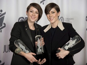 Tegan and Sara celebrate their three Juno Awards for Pop Album of the Year, Group of the Year and Single of the Year during the Junos in Winnipeg on Sunday, March 30, 2014. THE CANADIAN PRESS/Jonathan Hayward