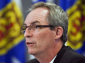 Ron MacDonald fields questions at a news conference in Halifax on Tuesday, Sept. 27, 2011. Plans are in the works to create a single, civilian-led agency to police the police in Atlantic Canada. Senior government officials in the four provinces have confirmed the plan is to expand Nova Scotia's Serious Incident Response Team into a region-wide investigator. THE CANADIAN PRESS/Andrew Vaughan