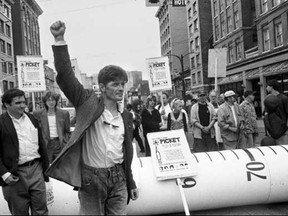 Then-president of Vancouver Area Network of Drug Users (VANDU) Dean Wilson takes part in a protest over HIV and overdose deaths, with a giant syringe in background in this July 18, 2002, handout image. THE CANADIAN PRESS/HO-Elaine Briere, *MANDATORY CREDIT*