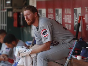 Chicago Cubs starting pitcher Eddie Butler sits in the dugout during the second inning of a baseball game against the Cincinnati Reds, Saturday, July 1, 2017, in Cincinnati. (AP Photo/John Minchillo)
