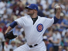 Chicago Cubs starting pitcher Jon Lester throws against the Pittsburgh Pirates during the first inning of a baseball game, Sunday, July 9, 2017, in Chicago. (AP Photo/Nam Y. Huh)